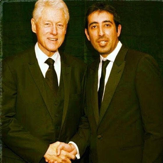 Kaiser Khan shaking hands with President Bill Clinton at a charity gala in London